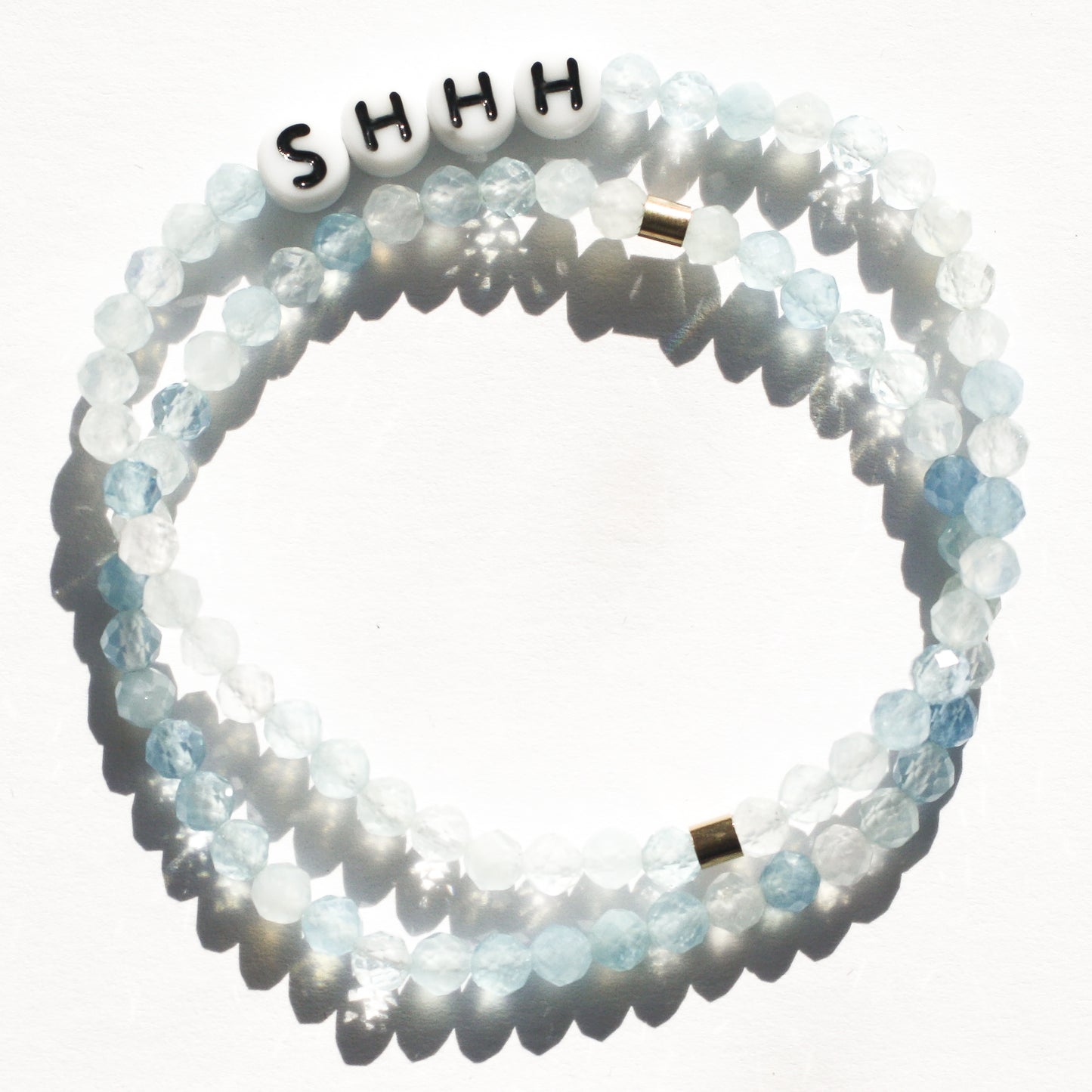Stack of aquamarine bracelets