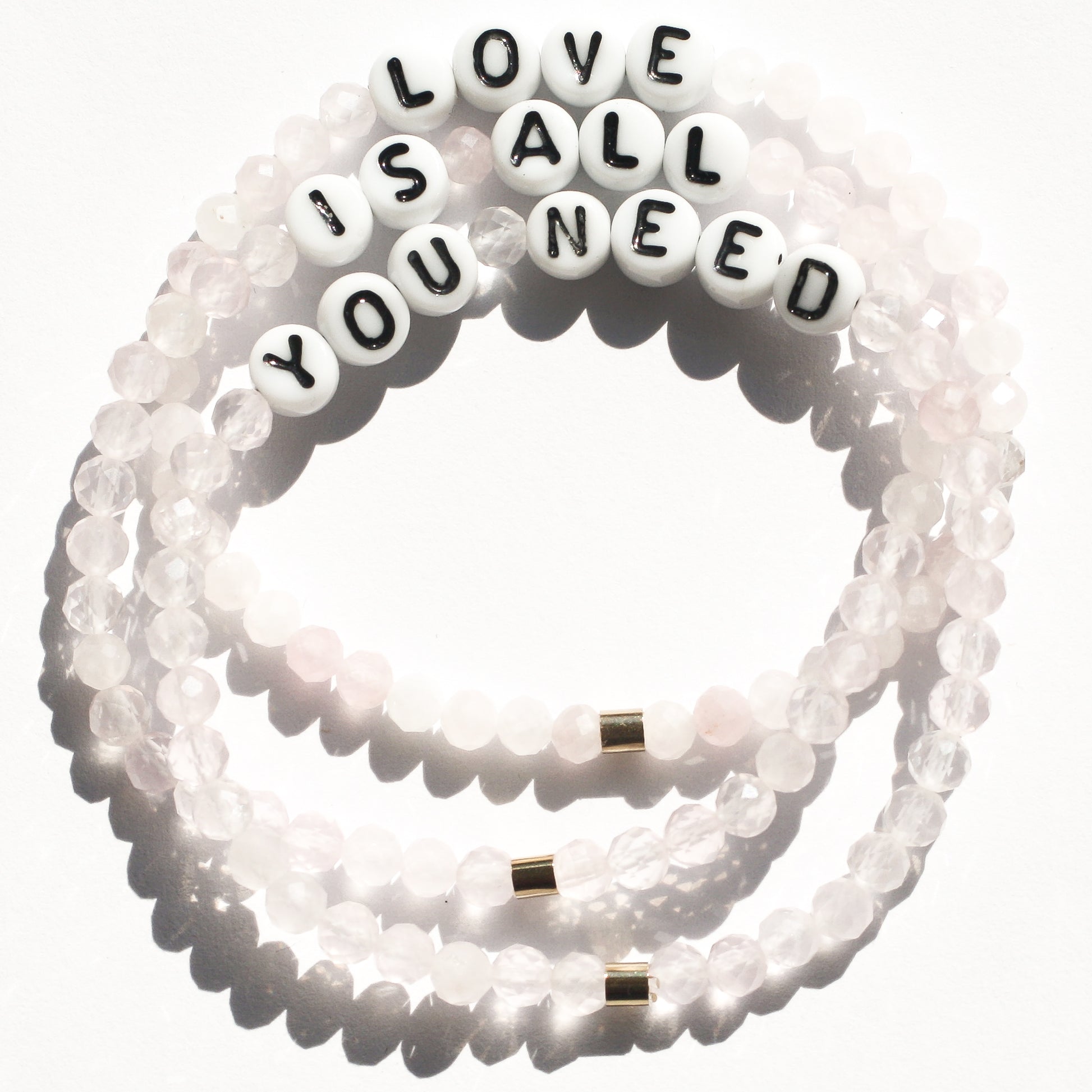 LOVE IS ALL YOU NEED bespoke bracelet stack in rose quartz