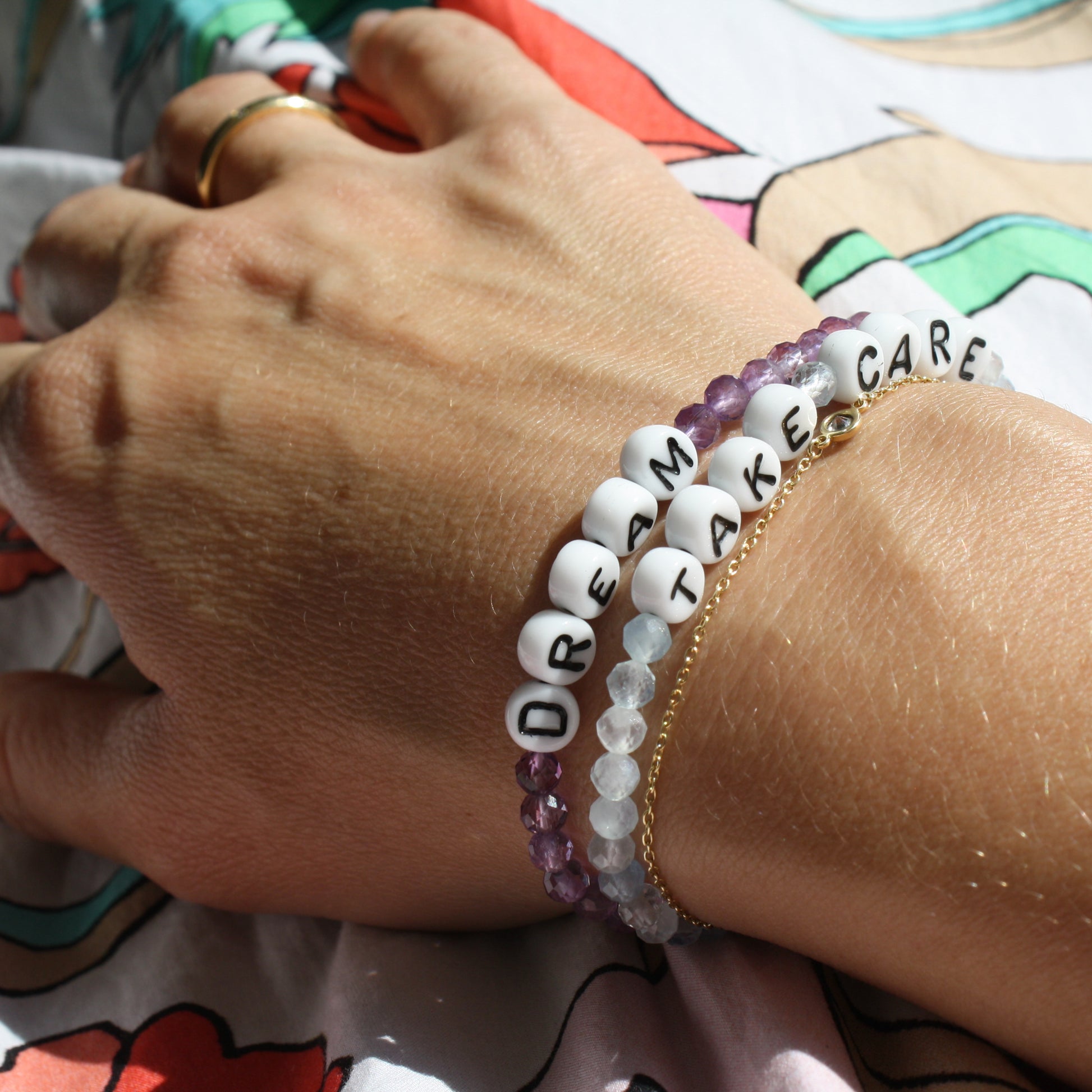 TAKE CARE and DREAM bracelets in aquamarine and amethyst
