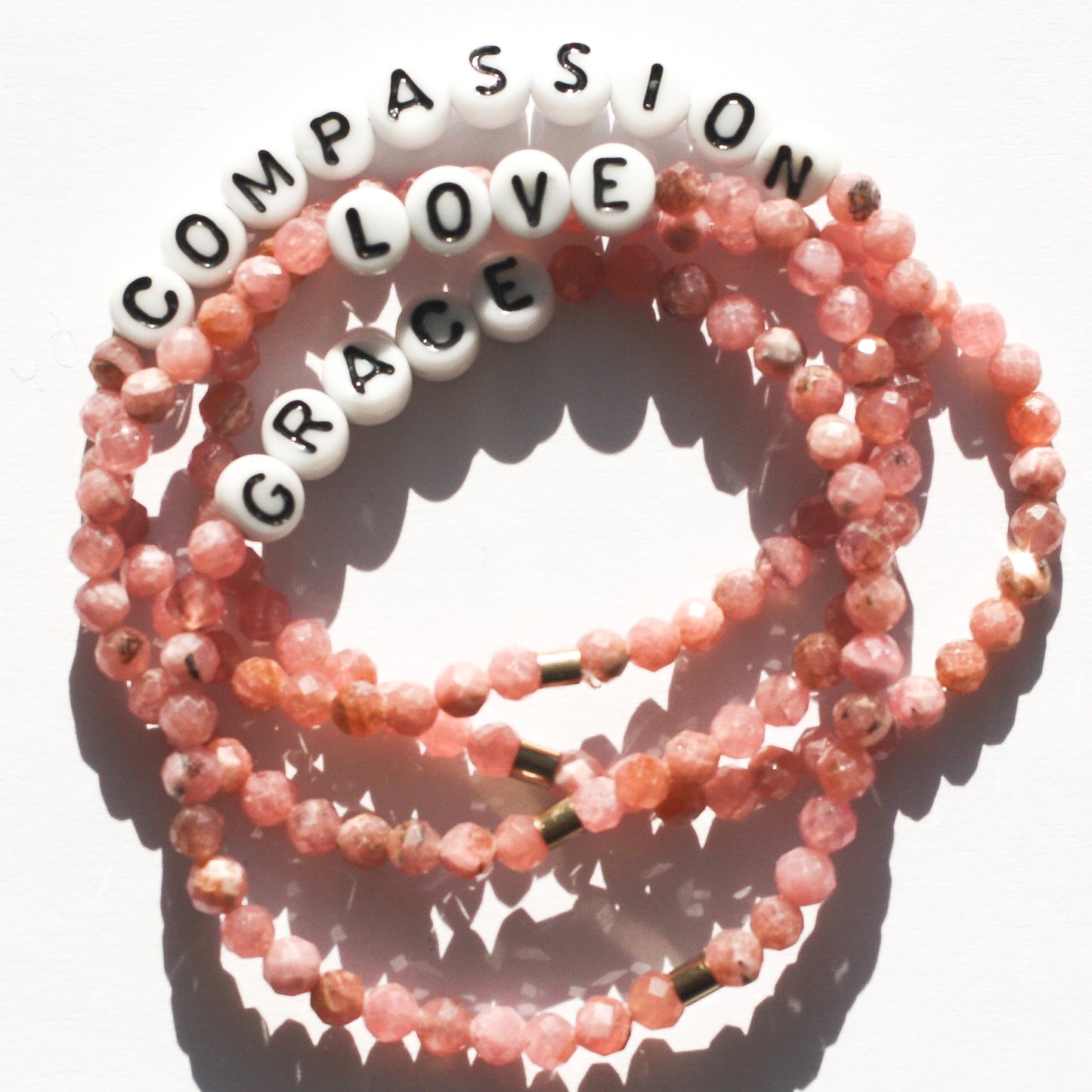 COMPASSION in Rhodochrosite